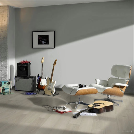 Room scene featuring Skyline White wide plank laminate, creating a bright and contemporary space with a clean and modern aesthetic.