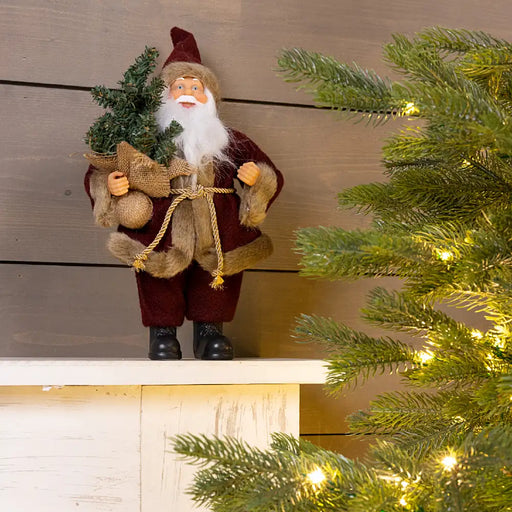 Smiling Santa standing figure with Tree