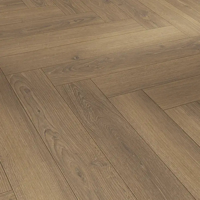 Close-up of the Honey Herringbone laminate plank with a matt finish, highlighting the fine oak grain and textured surface for a natural, untreated wood appearance.