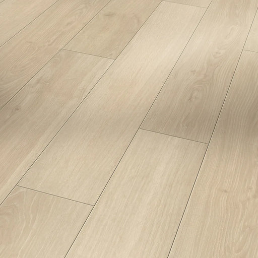 Close-up of Parador Studioline Sanded laminate flooring showing natural oak grain and matt textured surface with a bevelled edge.
