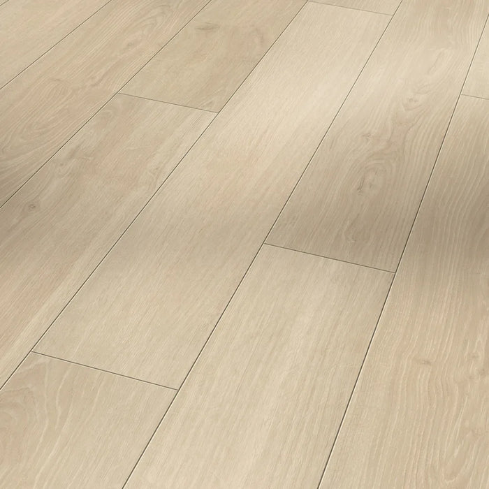 Close-up of Parador Studioline Sanded laminate flooring showing natural oak grain and matt textured surface with a bevelled edge.