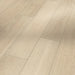 Close-up of Parador Studioline Sanded laminate flooring showing natural oak grain and matt textured surface with a bevelled edge.