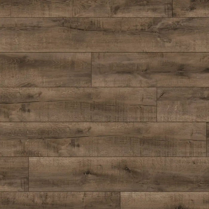 Close-up of Terra Oak flooring showing dark oak tones, subtle lighter shades, rustic texture, and bold dark knots.