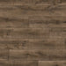Close-up of Terra Oak flooring showing dark oak tones, subtle lighter shades, rustic texture, and bold dark knots.
