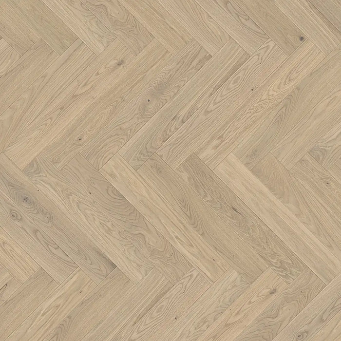 Detailed view of Bardolino White engineered herringbone plank showing the subtle whitewashed oak texture and clean bevel edges.