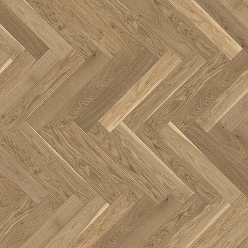 Detail of Trendtime 3 Cream Herringbone flooring showing the light oak finish, fine grain pattern, and precise parquet layout.