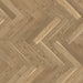 Detail of Trendtime 3 Cream Herringbone flooring showing the light oak finish, fine grain pattern, and precise parquet layout.
