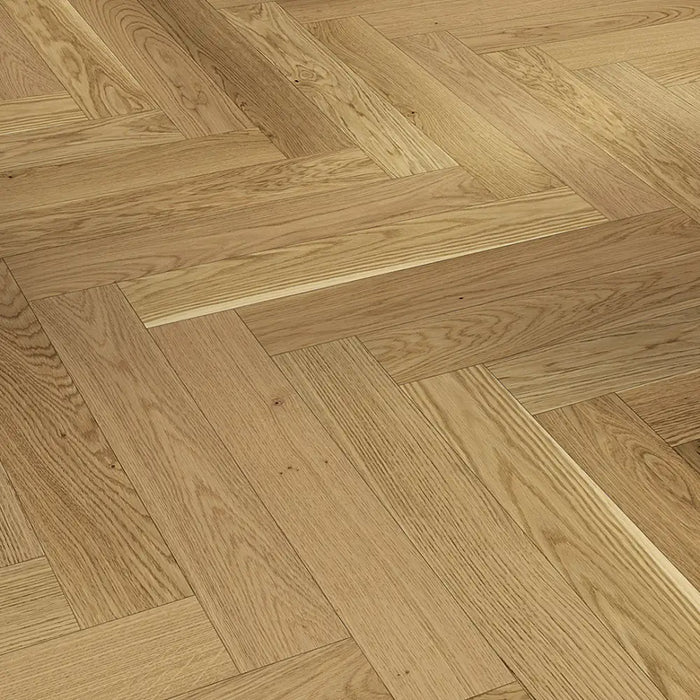 Detailed view of Trendtime 3 Oak Herringbone showing the matt lacquered finish, tight joints, and subtle bevels between strips.