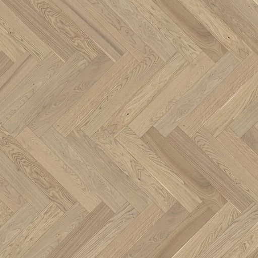 Close-up of Trendtime 3 Pure Herringbone flooring showing clean oak grain, subtle texture, and smooth matt lacquer finish.