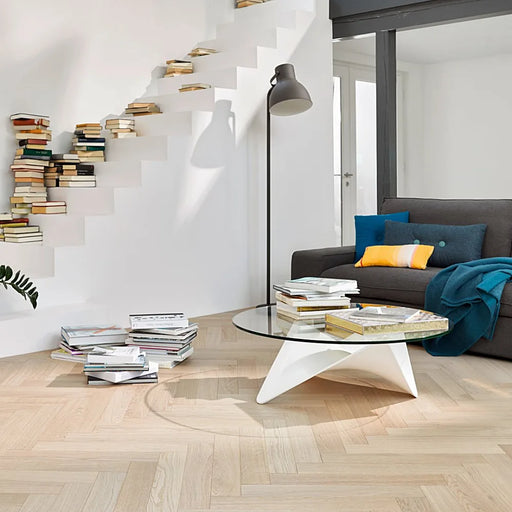 Trendtime 3 Pure Herringbone flooring in a stylish dining room with mid-century furniture.