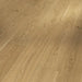 Close-up of Molvina Natural planks showing subtle wood grain detail and smooth matt lacquered finish.