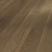 Detailed view of Trendtime 4 Nougat flooring showing oak grain texture, mini bevel edge, and matt lacquer finish.