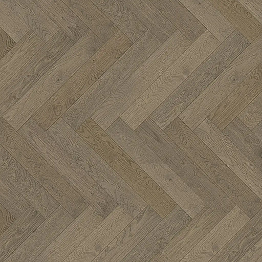 Close-up of Chalet Grey engineered herringbone plank showing a softly brushed grain with cool-toned grey variation and matt lacquer finish.