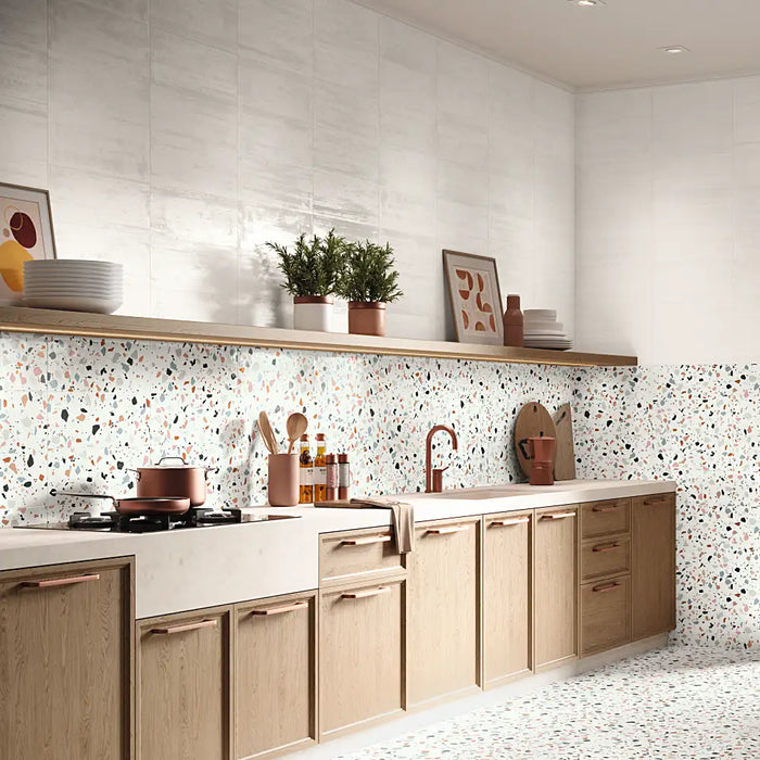 A kitchen backsplash finished with Trendy Mix wall tiles, showing a colourful patterned design.