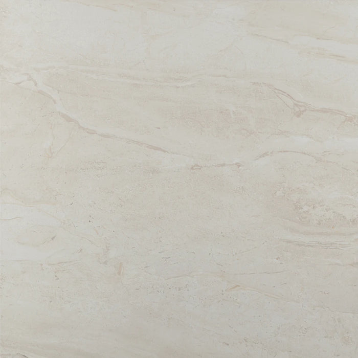 Close-up of Tropico Marfil Gloss tile showing its soft cream shade and polished reflective surface.