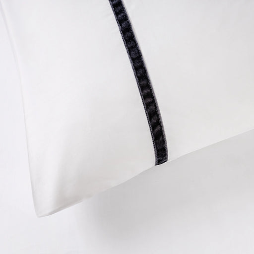 Close-up of White/Dark Grey Faux Velvet duvet set showing 300 thread count sateen cotton and plush velvet detailing.