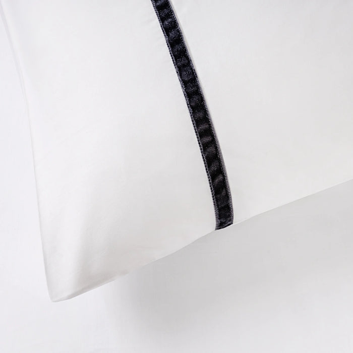 Close-up of White/Dark Grey Faux Velvet duvet set showing 300 thread count sateen cotton and plush velvet detailing.