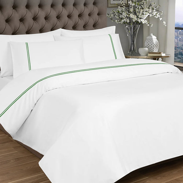 White and green 2 row cord duvet set styled on a bed in a modern bedroom, showing elegant sateen cotton finish.