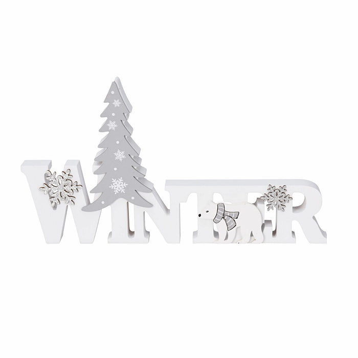 Close-up of white 'Winter' text ornament showing snowy texture and soft sparkle.