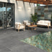 Sleek outdoor area with Work B Coal Anti-Slip Porcelain tiles in a deep charcoal tone.