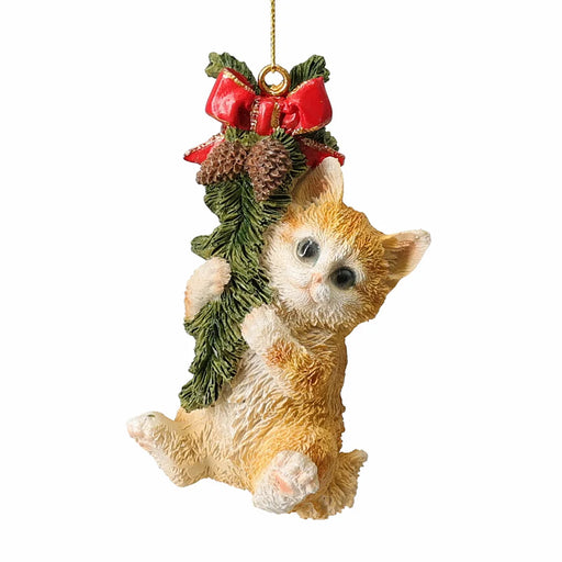 Close-up of Yellow Cat Hanging From A Garland showing cheerful expression and detailed garland elements.