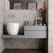 Art Nouveau La Rambla Grey patterned porcelain tiles installed on a bathroom feature wall
