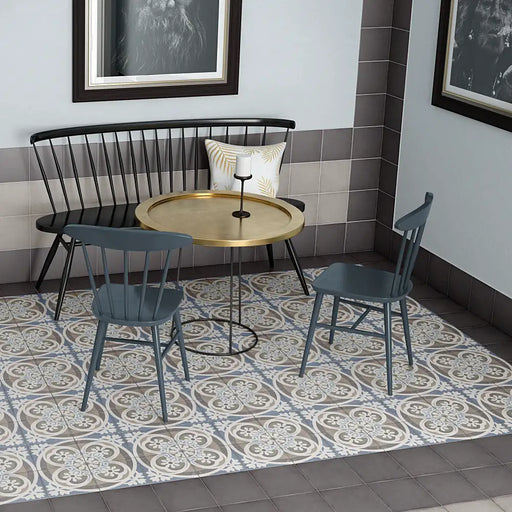 Art Nouveau Music Hall patterned porcelain floor tiles installed in a vintage-inspired café with decorative blue and grey design