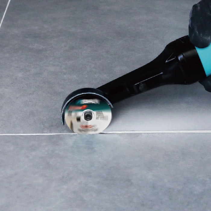 Bihui Mini Angle Grinder cutting a straight line along a floor tile