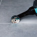 Bihui Mini Angle Grinder cutting a straight line along a floor tile