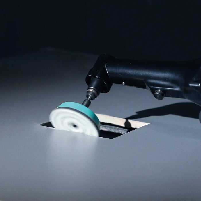 Bihui Mini Angle Grinder polishing the edge of a tile opening with a mini polishing pad