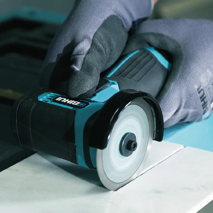 Bihui Mini Continuous Cutting Blade fitted to a mini angle grinder cutting a marble tile