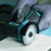 Bihui Mini Continuous Cutting Blade fitted to a mini angle grinder cutting a marble tile