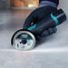 Bihui Mini Cordless Angle Grinder cutting a straight line in a floor tile