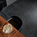 Bleuemix Black Soft Porcelain 90x90 tile in a dining/kitchen floor setting