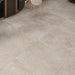 Bleuemix Taupe Porcelain 90x90 tile in a living/dining floor setting