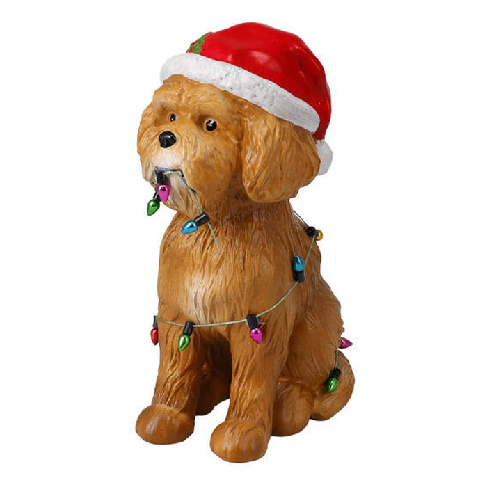 Curly brown dog figure in a Santa hat wrapped in colourful Christmas lights