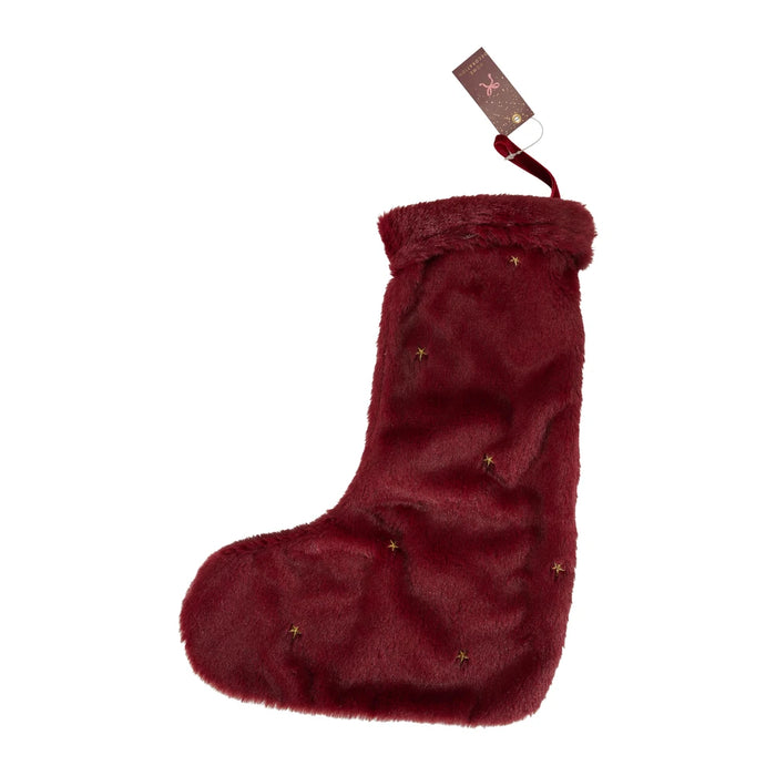 Burgundy plush Christmas stocking with a faux fur cuff, small gold embroidered stars and a hanging loop