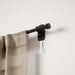 Cappa Adhera matt black curtain pole adhesive bracket installation close-up