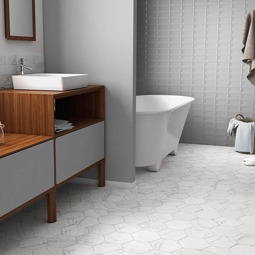 Carrara Hexagon marble effect porcelain floor tiles with a matt finish in a modern bathroom