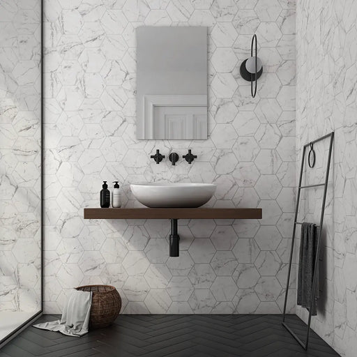 Carrara Hexagon marble effect porcelain tiles installed on bathroom walls with a matt finish in a contemporary bathroom