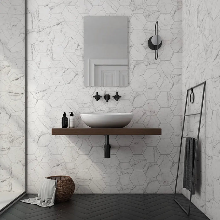 Carrara Hexagon marble effect porcelain tiles installed on bathroom walls with a matt finish in a contemporary bathroom