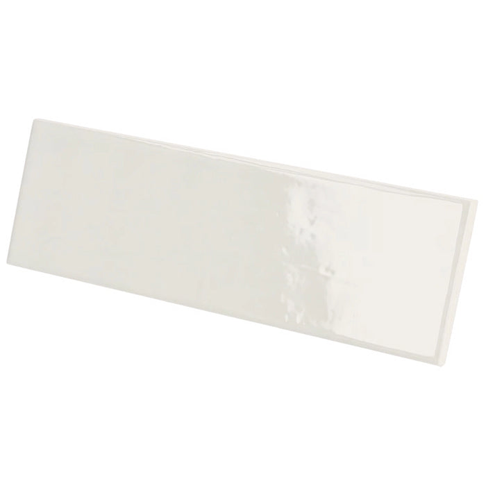 Country Blanco gloss wall tile in a crisp white colour with a slim brick format, shown at an angle.