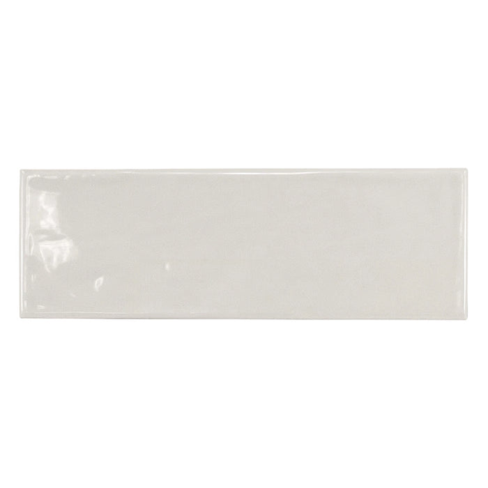 Country Gris Claro gloss wall tile in a soft light grey colour, shown as a single 6.5 × 20 cm white body ceramic tile.