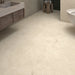 Dakota Cream marble-effect porcelain tile floor in a bathroom setting