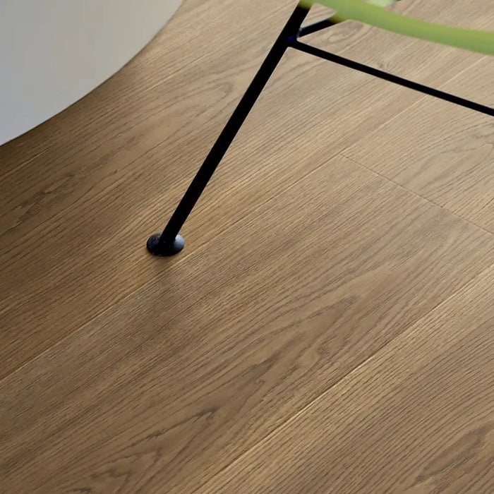 Pergo Drammen Ricard laminate flooring detail with chair leg in a living space
