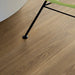 Pergo Drammen Ricard laminate flooring detail with chair leg in a living space