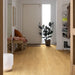 Pergo Drammen Cappuccino laminate flooring in a bright hallway setting