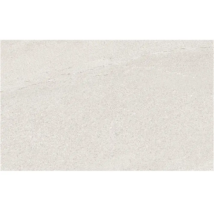 Close-up of Eddystone Blanco 33.3 x 55 ceramic wall tile showing subtle stone-effect texture