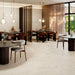 Garona Marfil Natural Rectified Porcelain 60x120 tile installed in a contemporary restaurant with large-format stone-effect flooring
