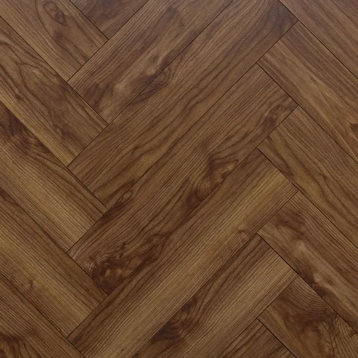 Close-up herringbone pattern detail of Glasgow 12mm walnut laminate flooring
